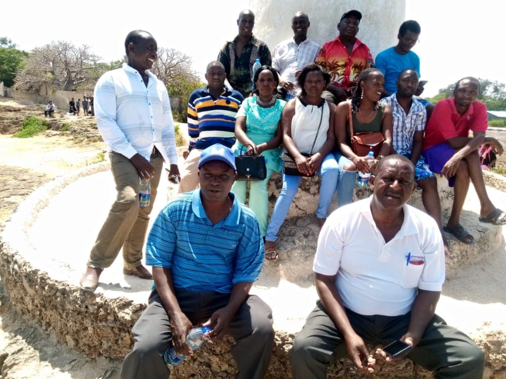 SACCO board and staff at Vasco da Gama Pillar, Malindi – team bonding in Mombasa sun.